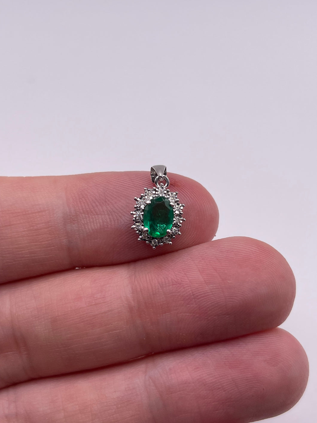 9ct white gold emerald and diamond pendant