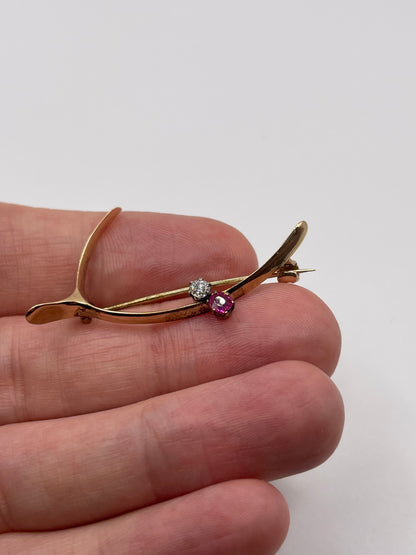 Antique 15ct gold ruby and diamond wishbone brooch