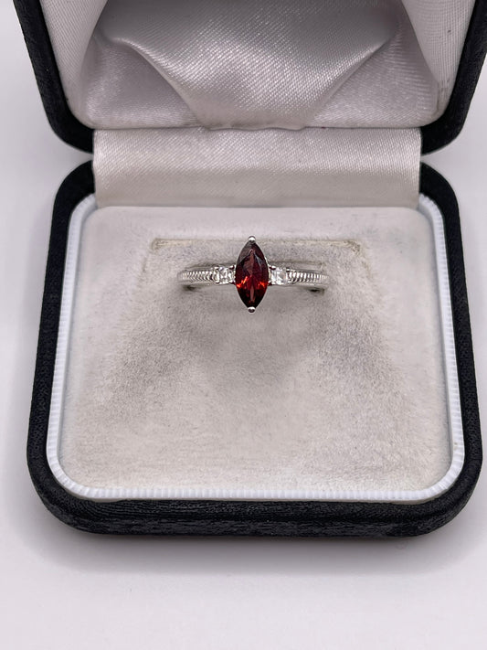Silver garnet and zircon ring