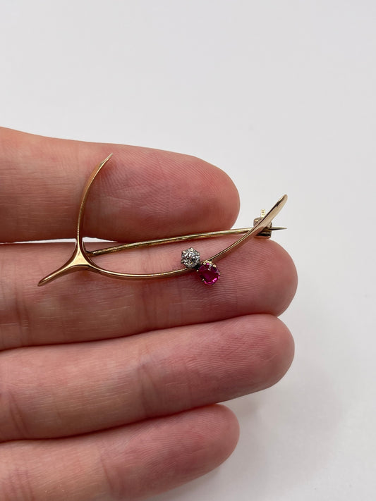 Antique 15ct gold ruby and diamond wishbone brooch
