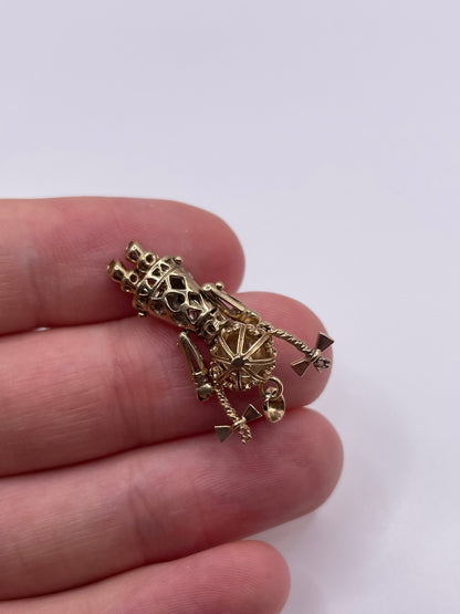 9ct gold articulated doll pendant