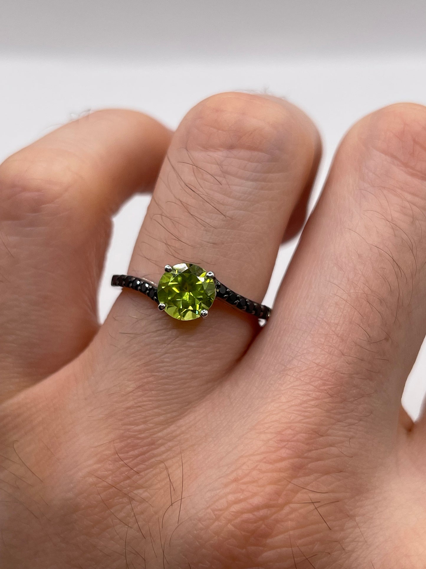 Silver peridot and spinel ring