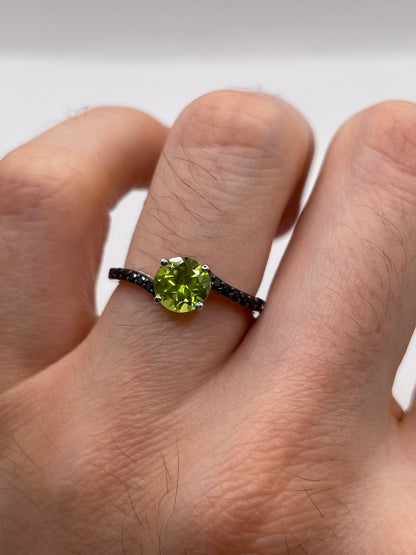 Silver peridot and spinel ring