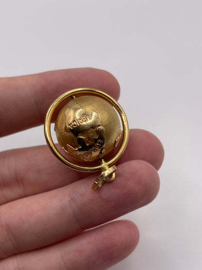 Heavy 18ct gold globe pendant