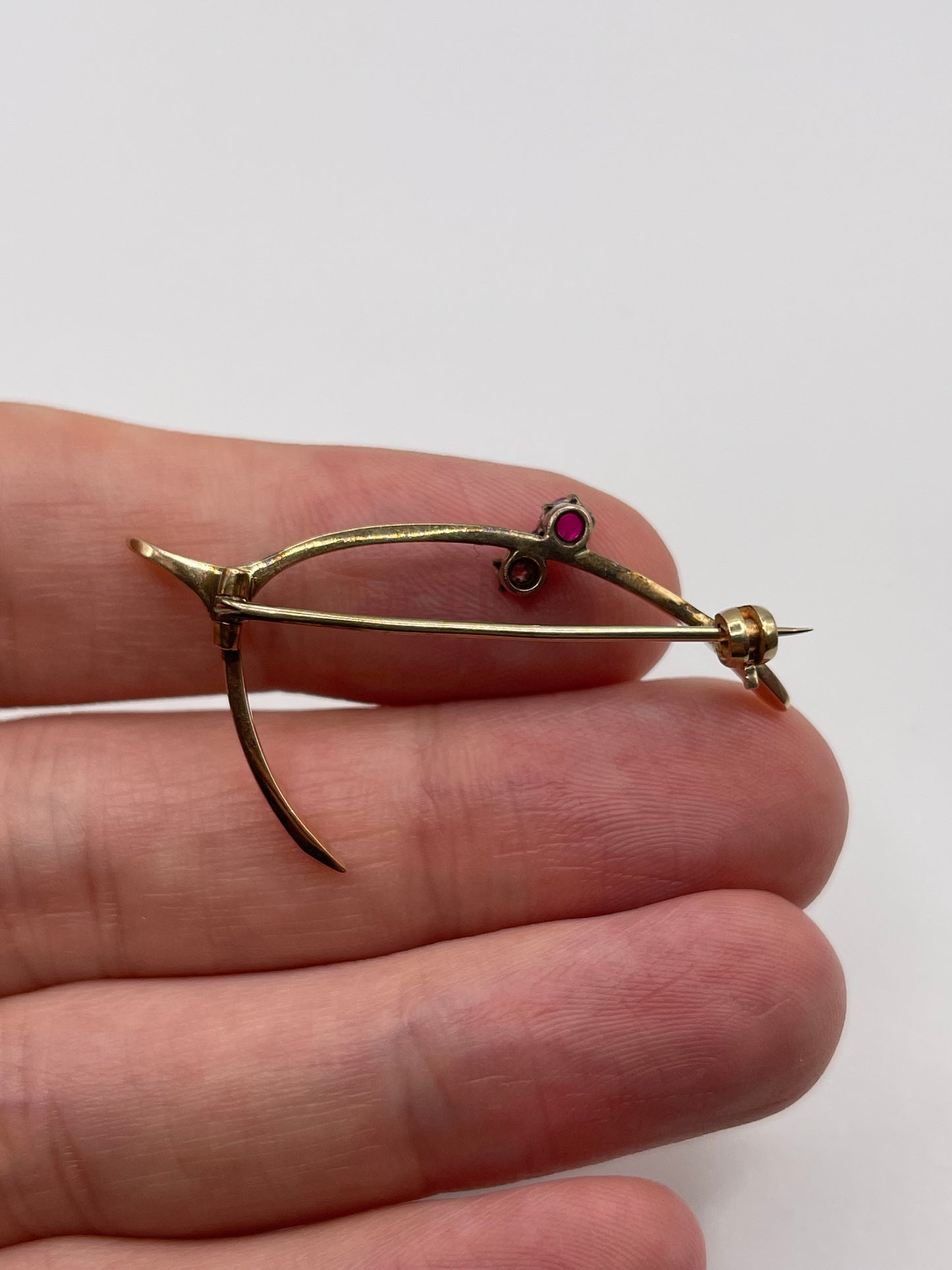 Antique 15ct gold ruby and diamond wishbone brooch