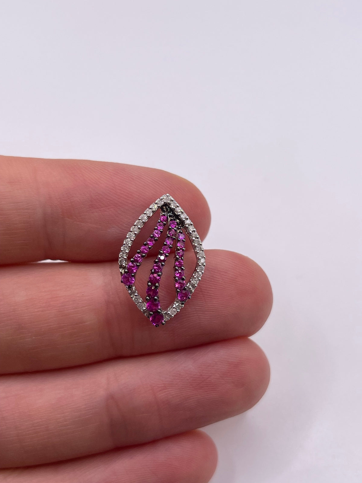 9ct white gold ruby and diamond pendant