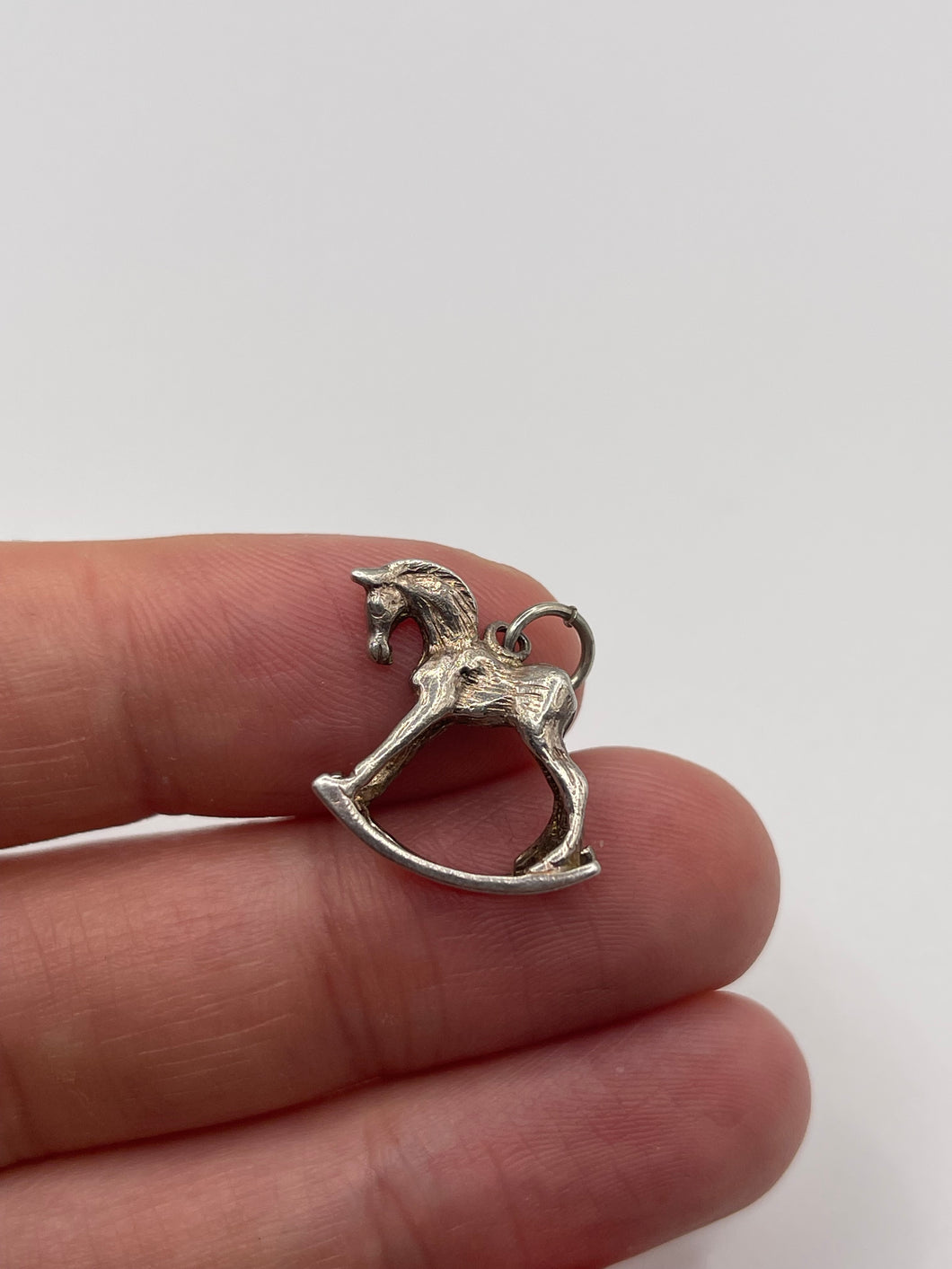 Silver rocking horse charm