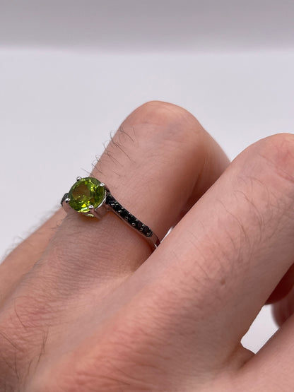 Silver peridot and spinel ring