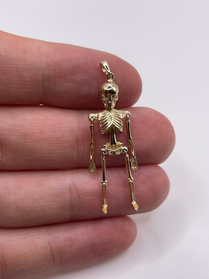 9ct gold articulated skeleton pendant