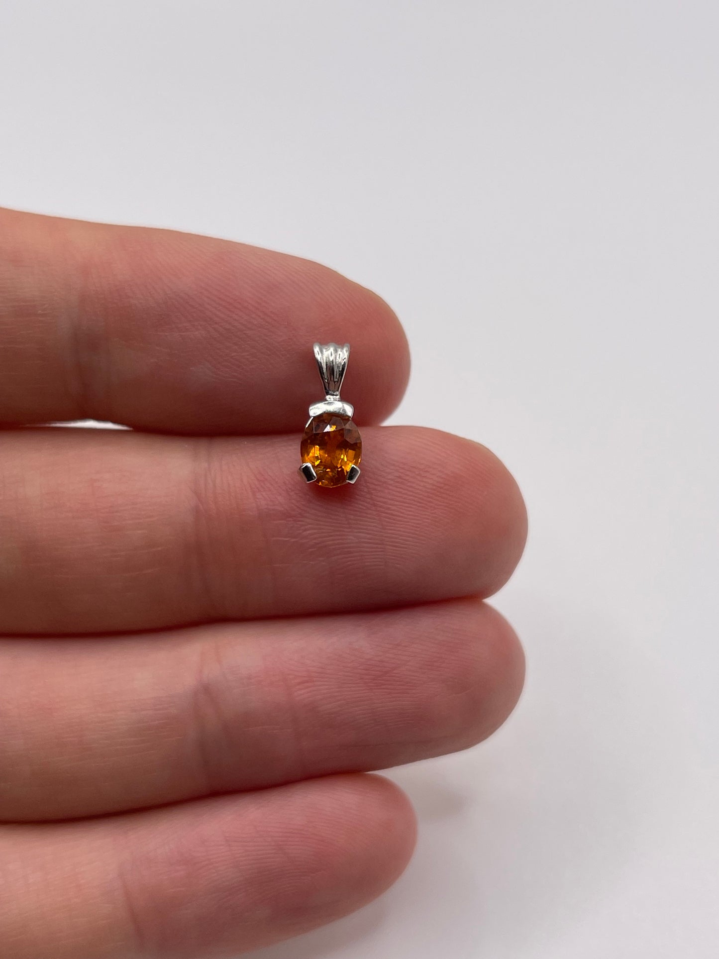 9ct white gold orange sapphire pendant