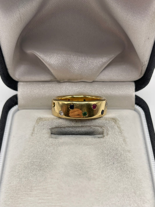 18ct gold ruby, emerald, sapphire and diamond eternity ring