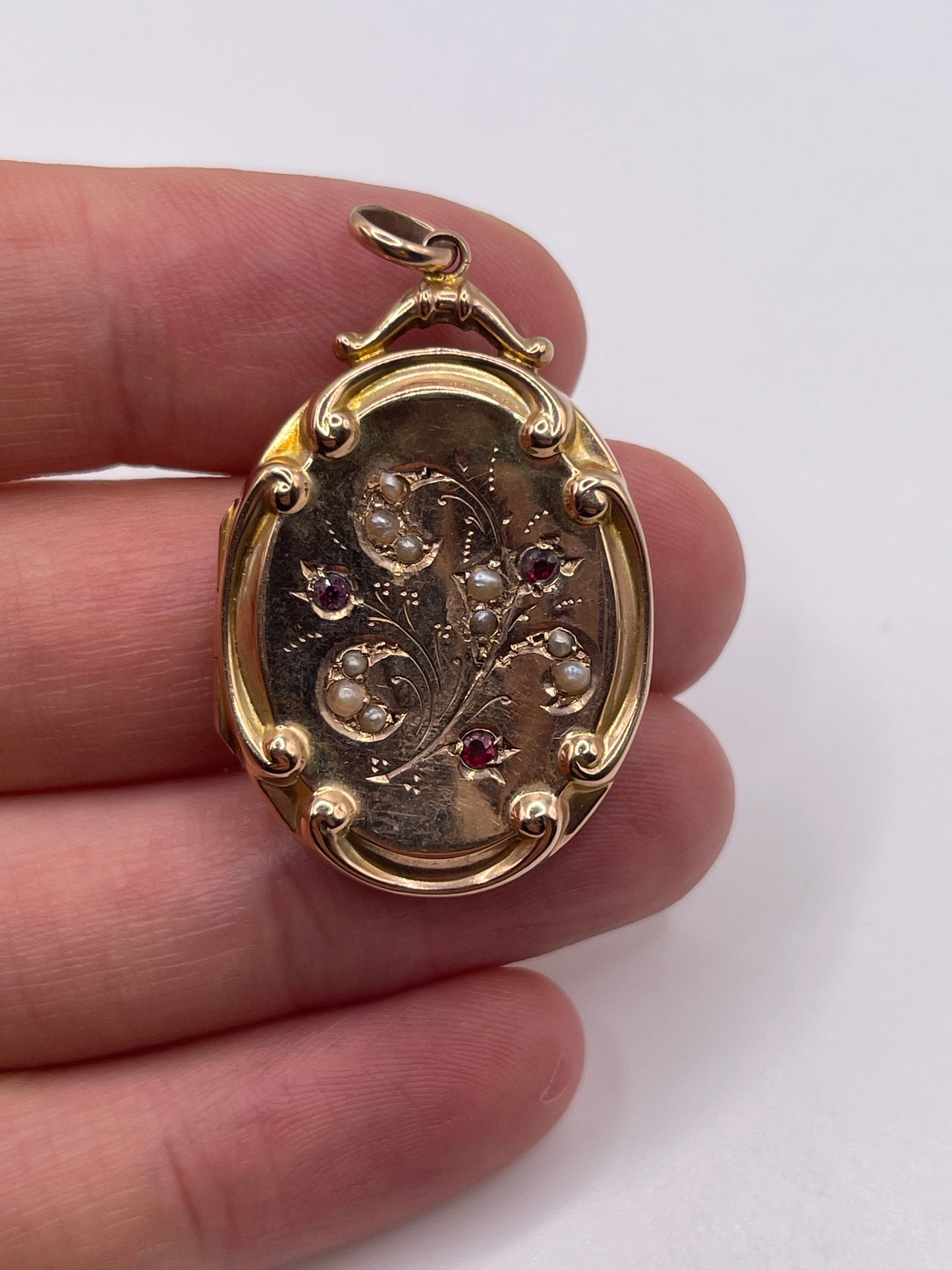 Antique 9ct rose gold garnet and pearl locket pendant