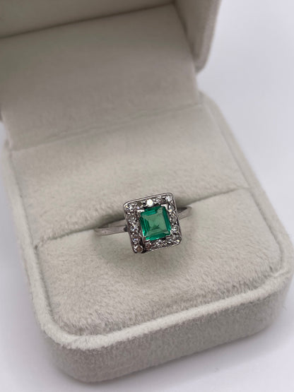 Platinum emerald and diamond ring