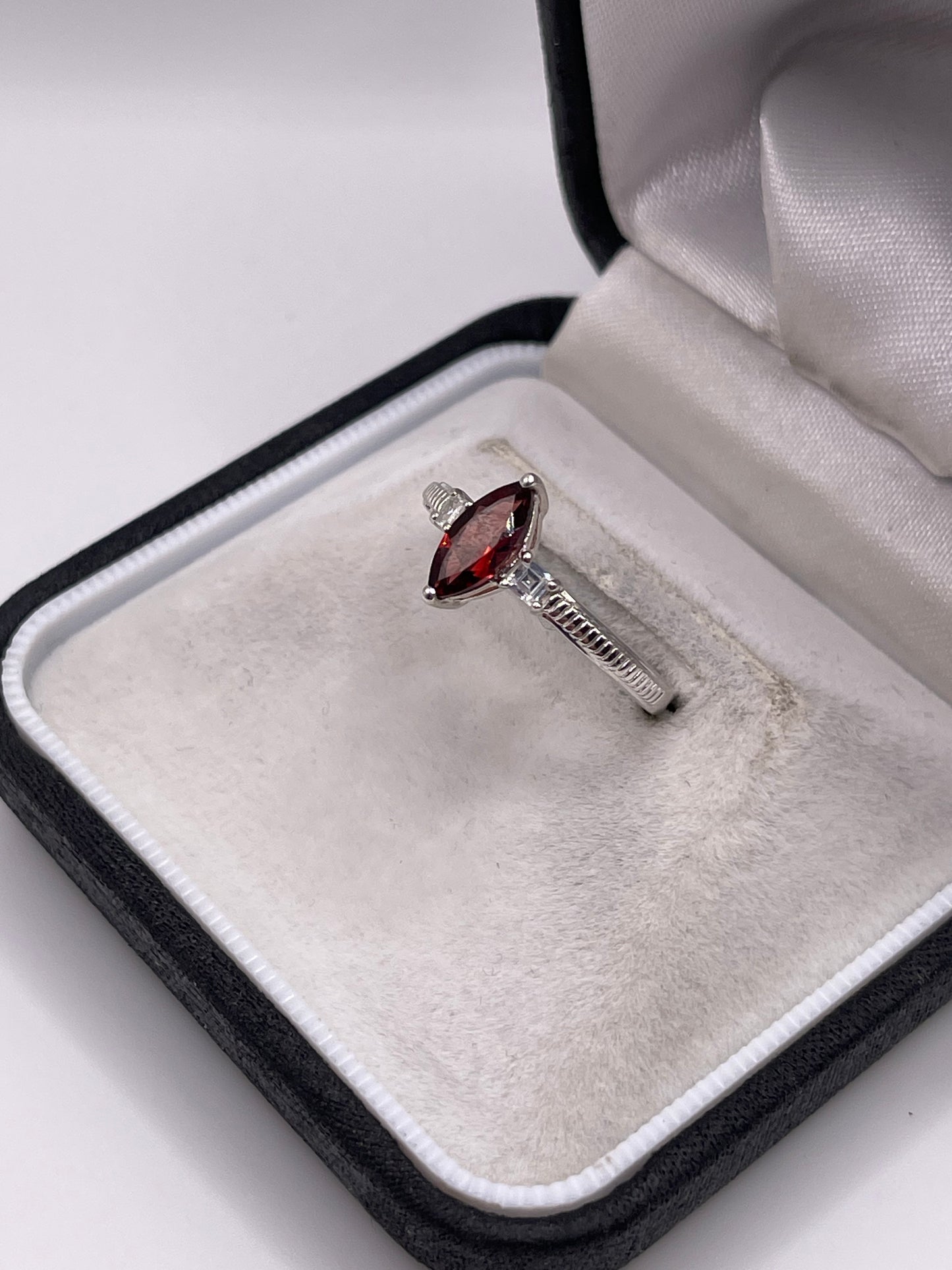 Silver garnet and zircon ring
