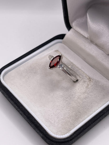 Silver garnet and zircon ring