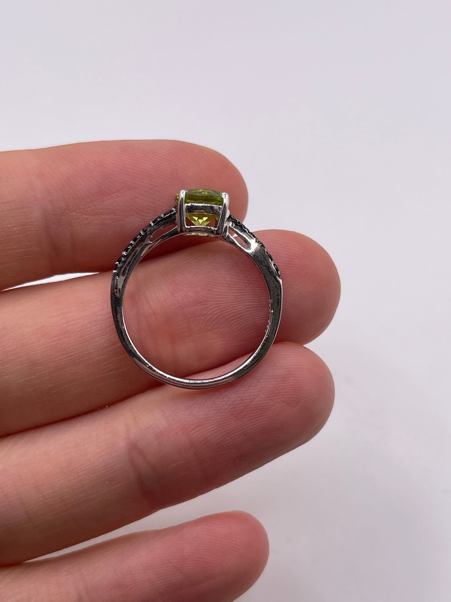 Silver peridot and spinel ring