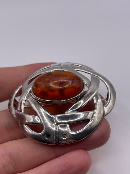 Silver amber brooch