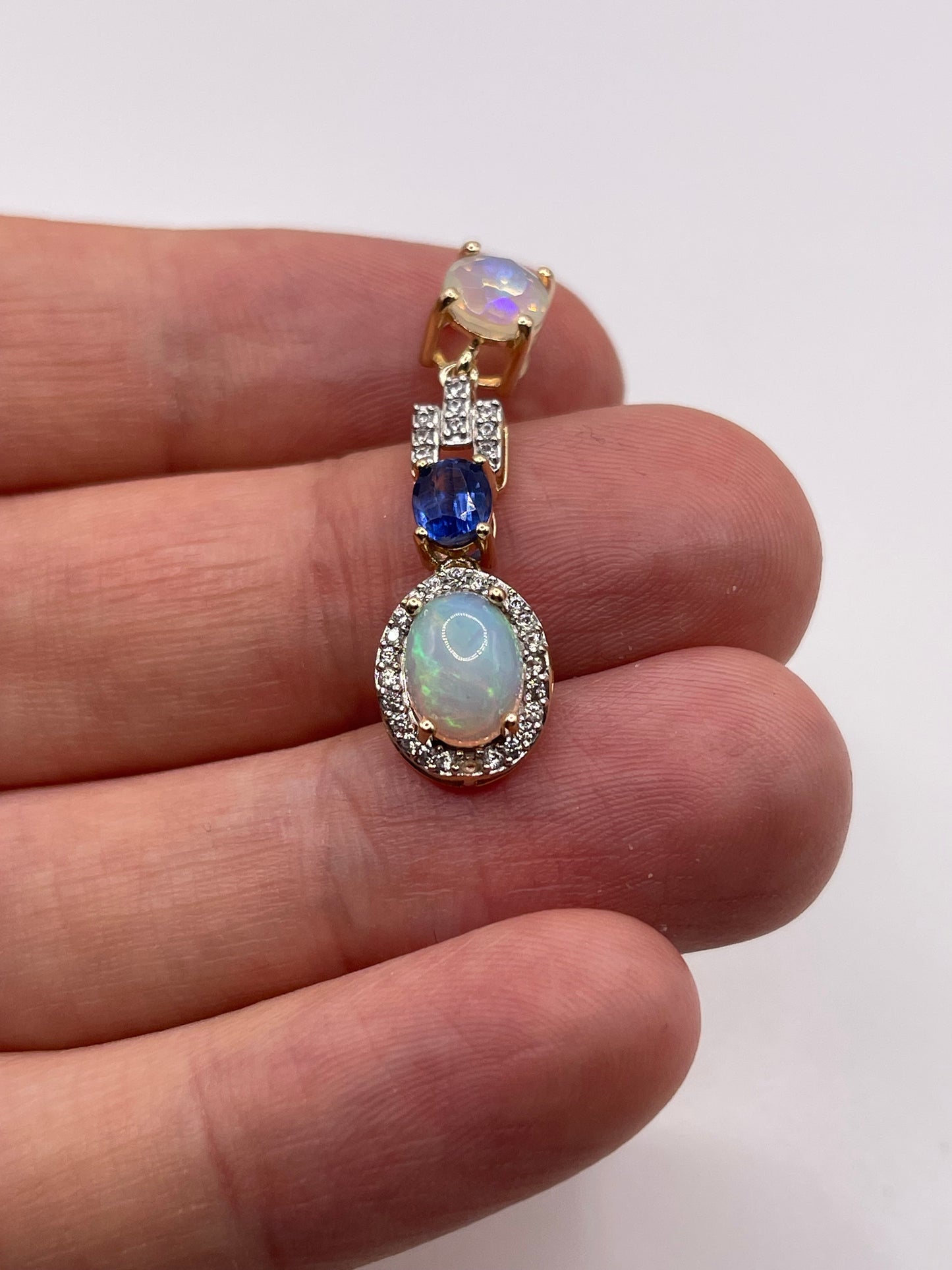 9ct gold opal, kyanite and zircon pendant