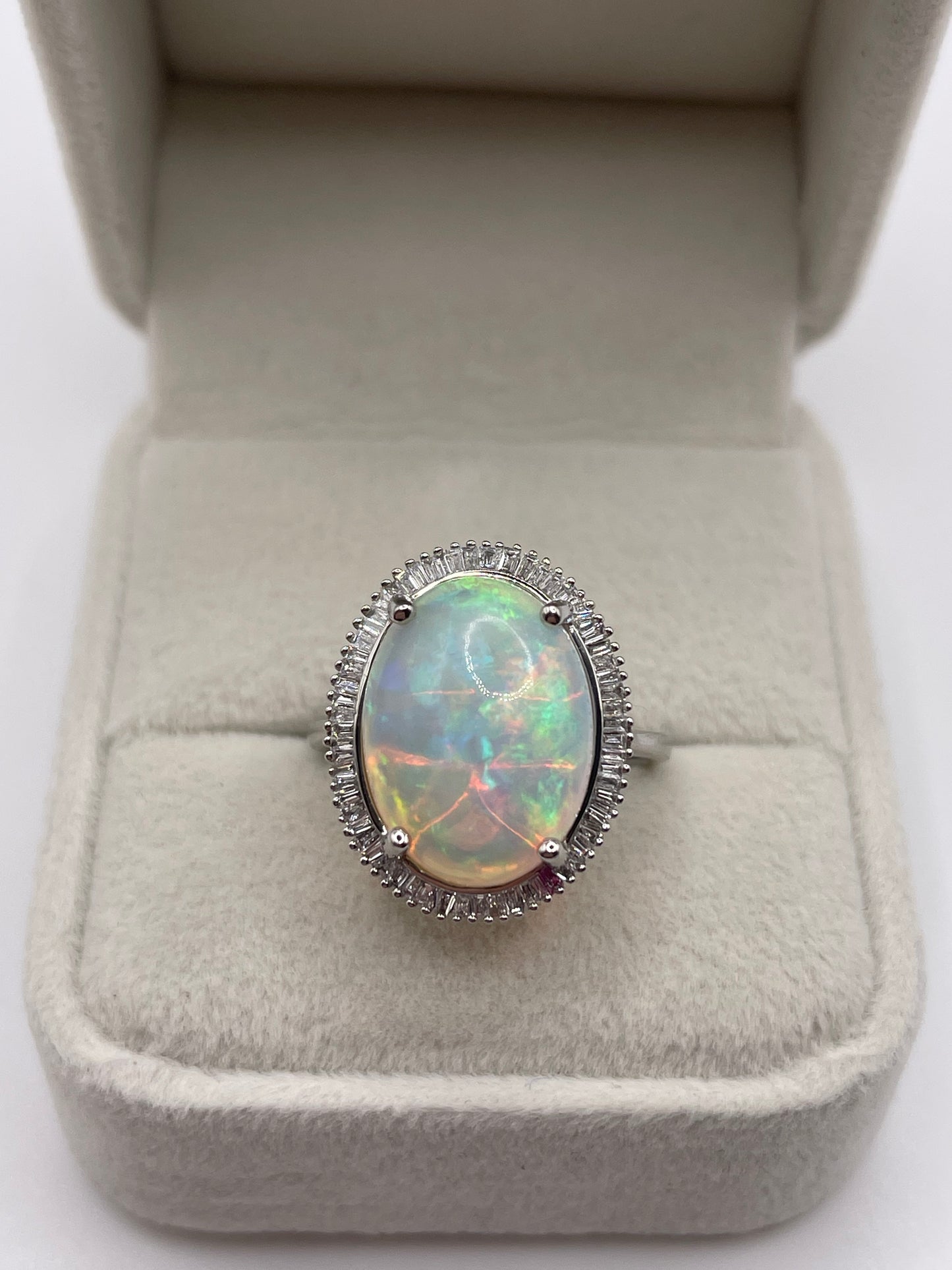 Platinum opal and diamond ring