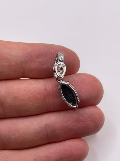 9ct white gold Ammolite and zircon pendant