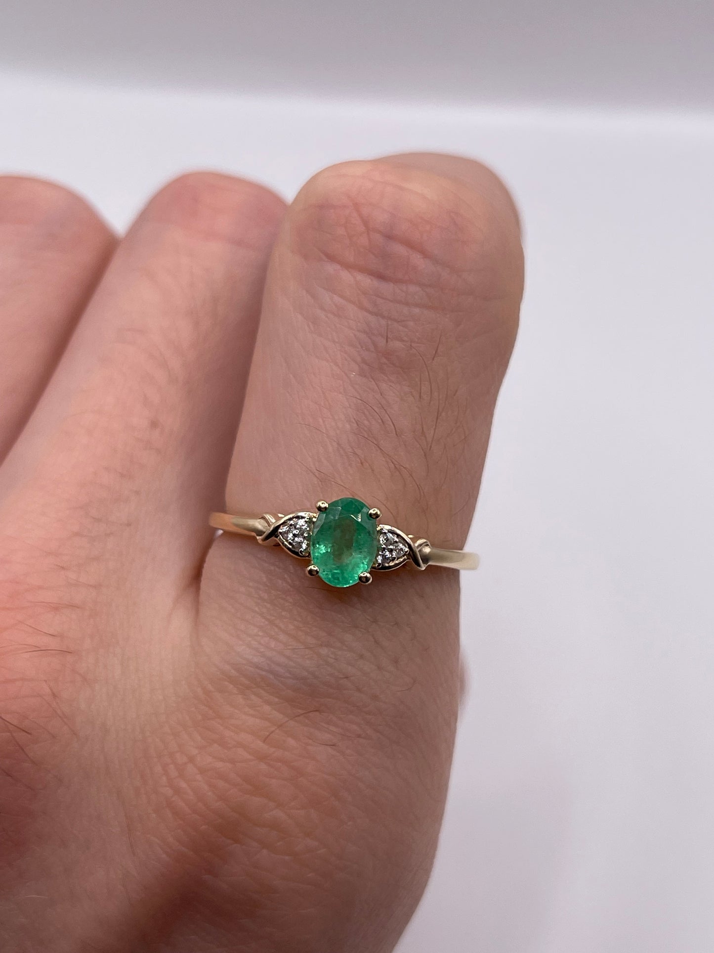 9ct gold emerald and zircon ring