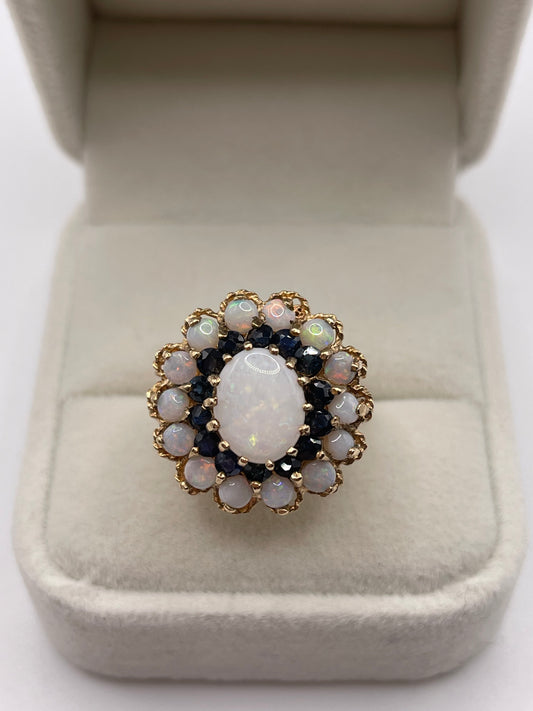 Heavy 9ct gold opal and sapphire cluster ring