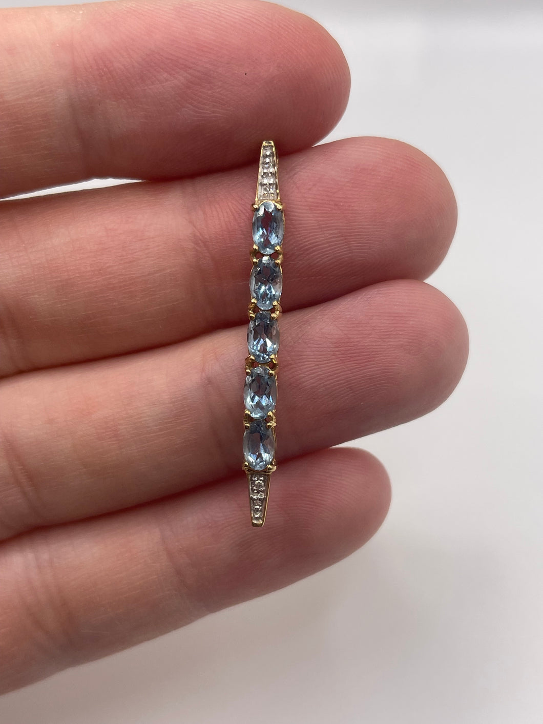 9ct gold blue topaz and diamond pendant