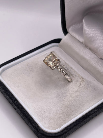 Silver topaz and zircon ring