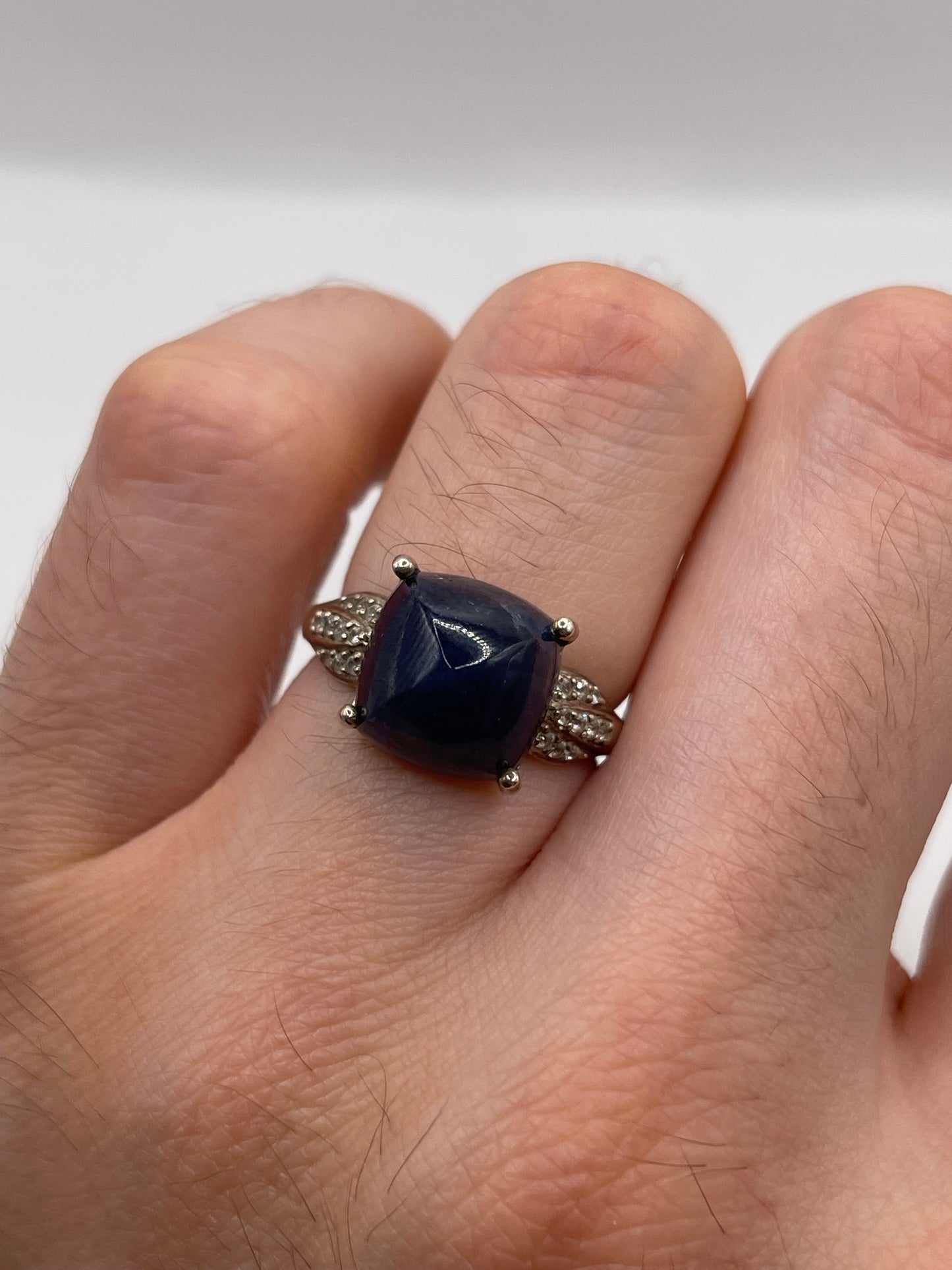Silver cabochon sapphire and zircon ring