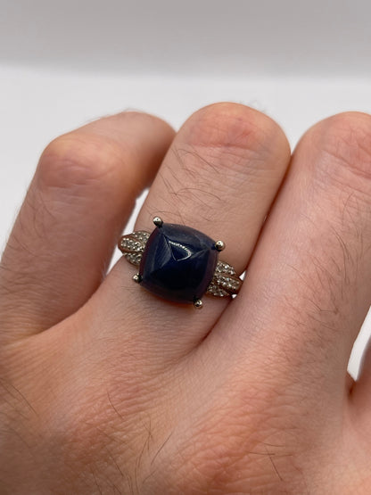Silver cabochon sapphire and zircon ring