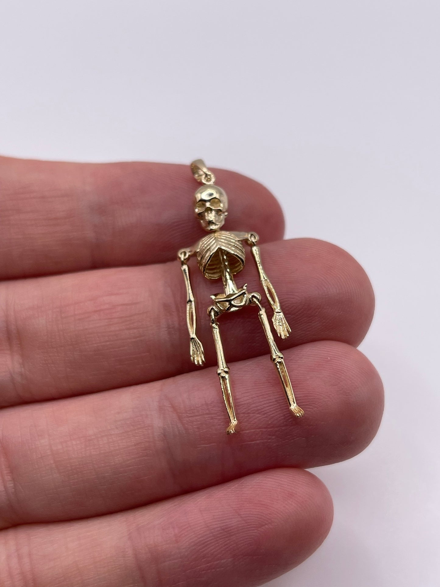 9ct gold articulated skeleton pendant