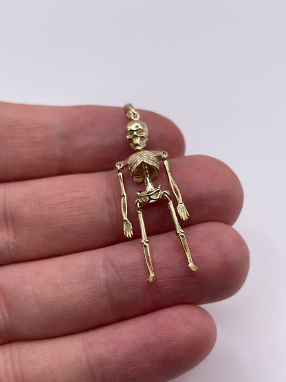 9ct gold articulated skeleton pendant