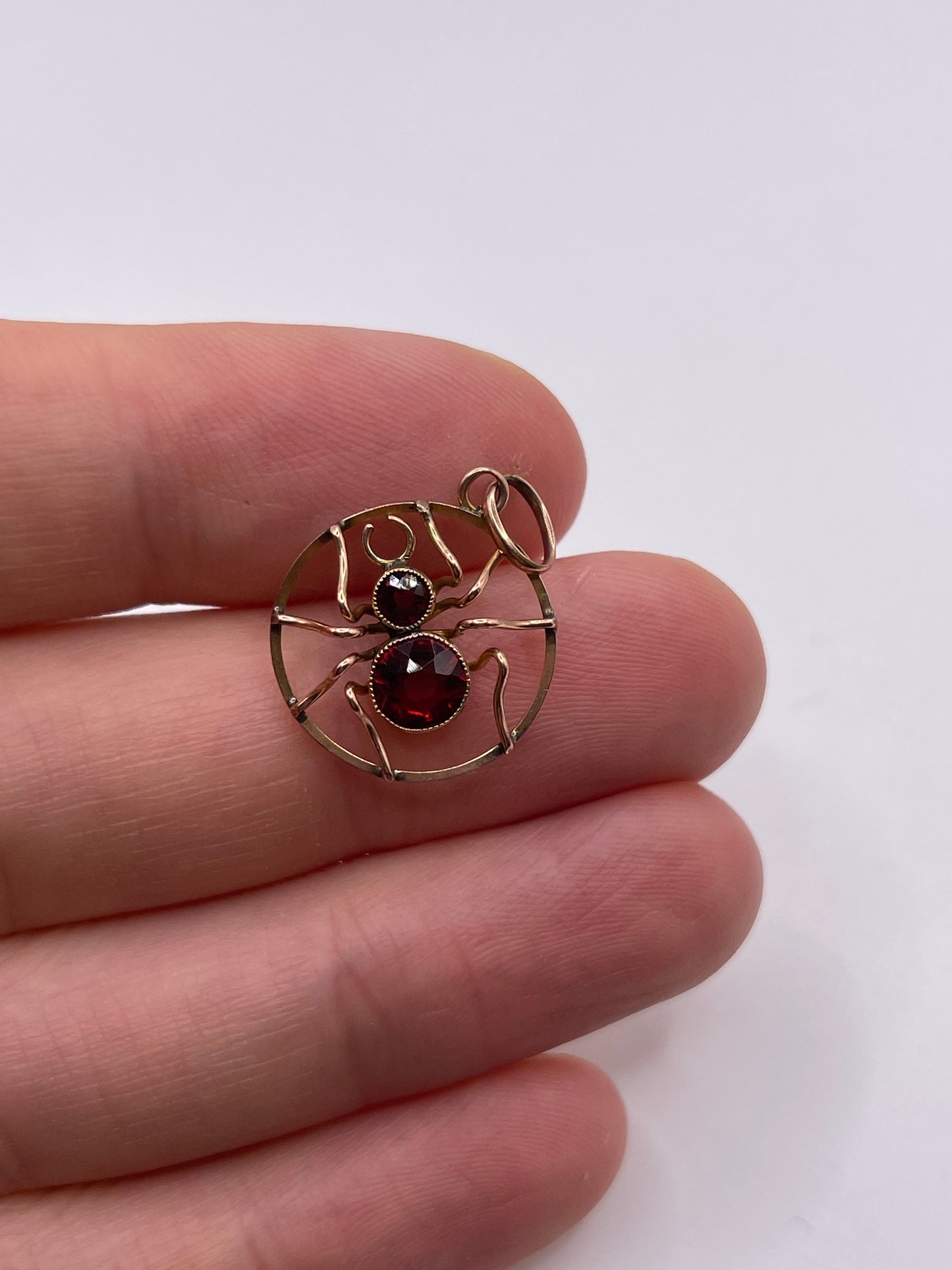 Antique 9ct gold paste spider pendant