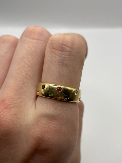 18ct gold ruby, emerald, sapphire and diamond eternity ring