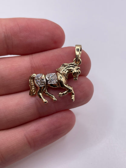 9ct gold stone set articulated horse pendant