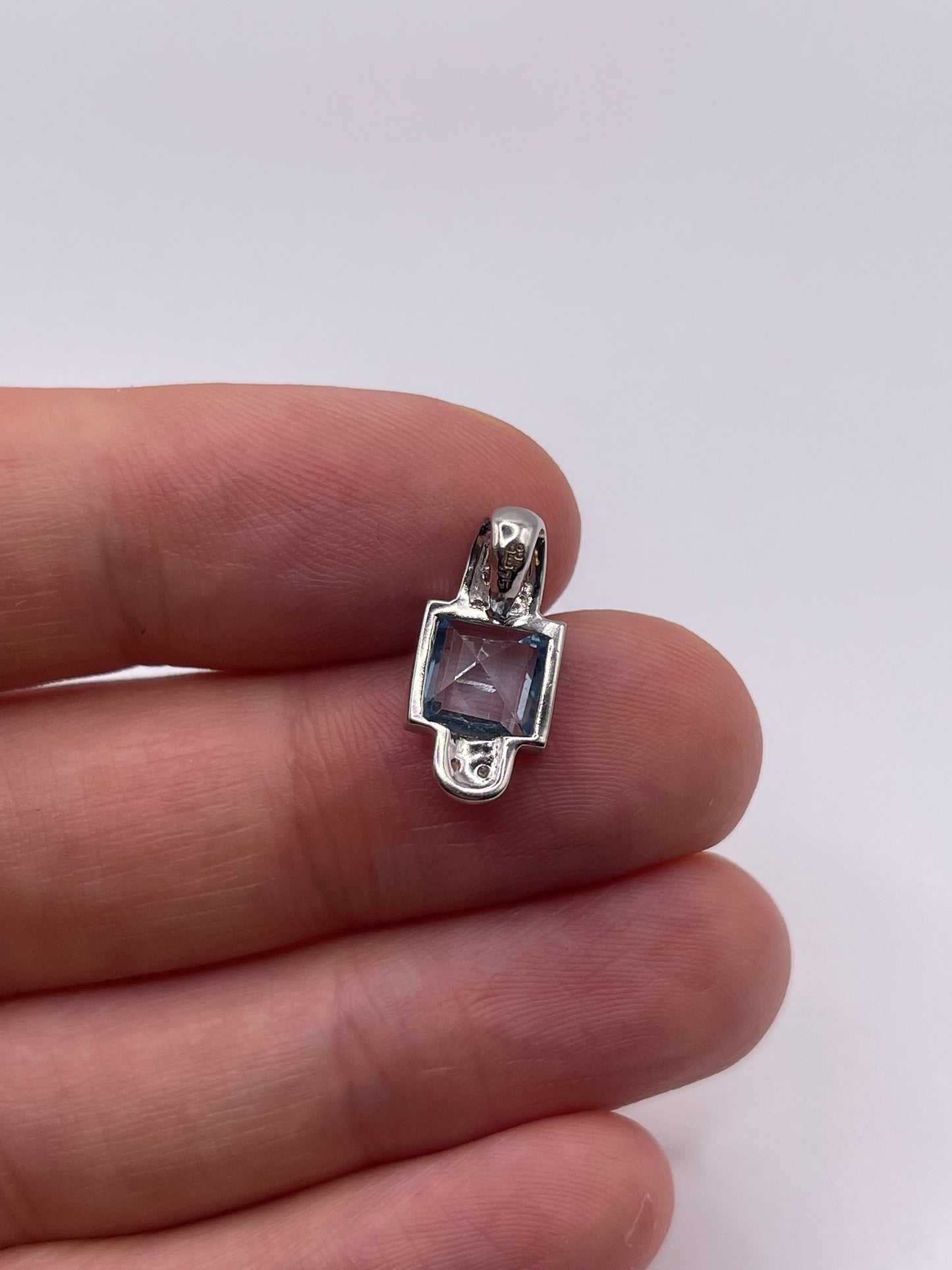 9ct white gold topaz and diamond pendant