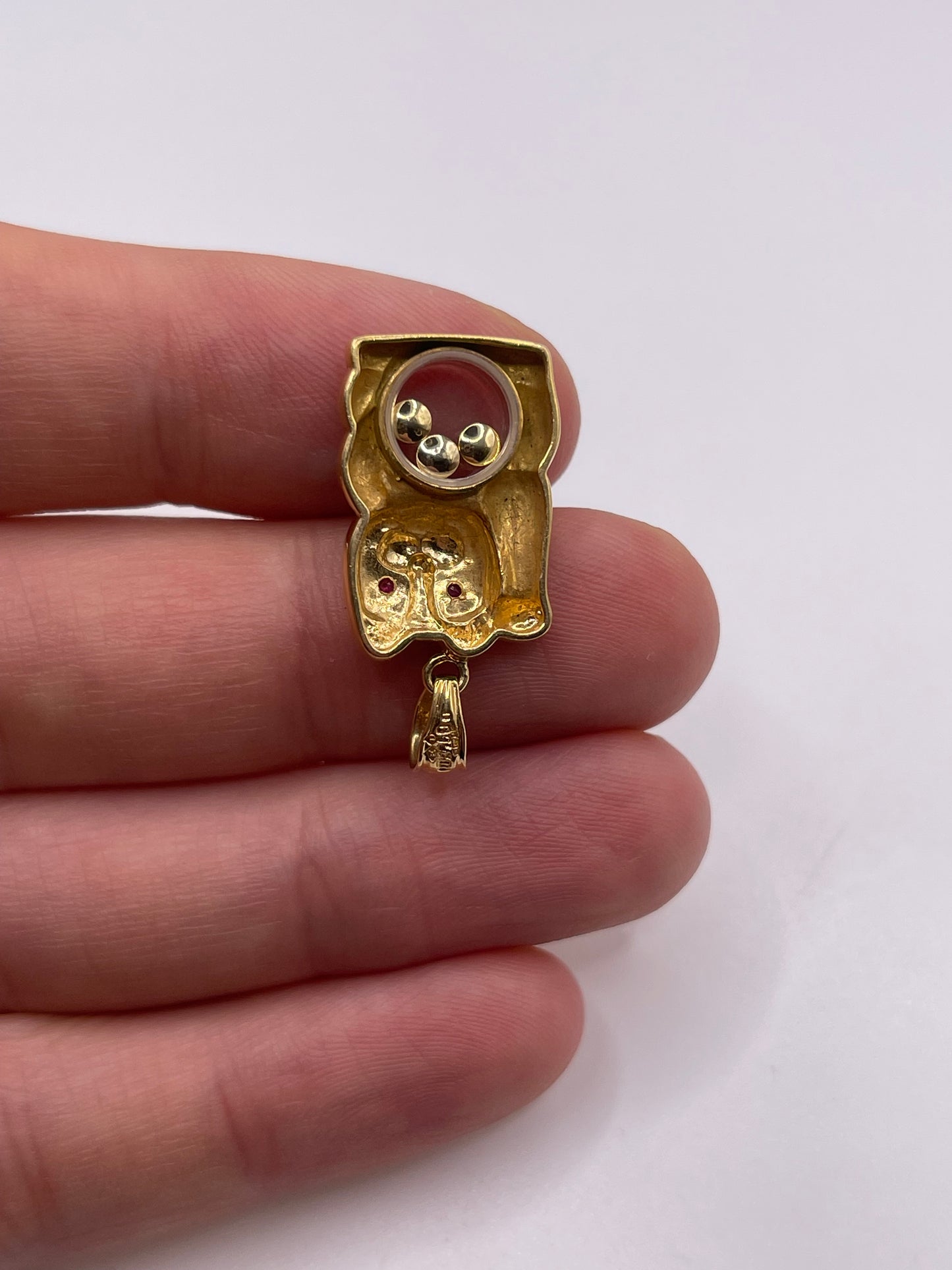 18ct gold ruby and diamond cat pendant