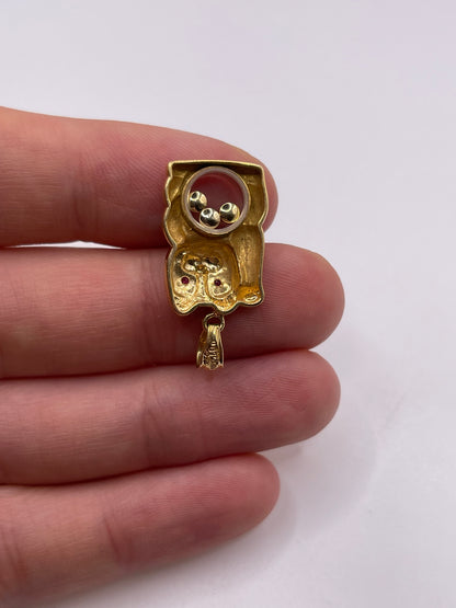 18ct gold ruby and diamond cat pendant
