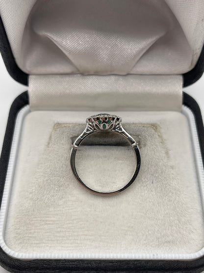 Platinum emerald and diamond ring