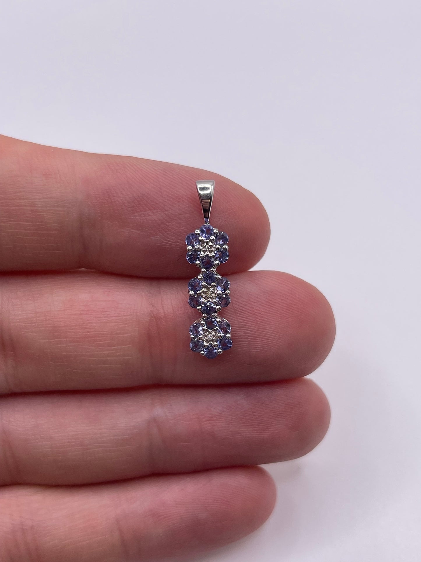 9ct white gold tanzanite and diamond pendant