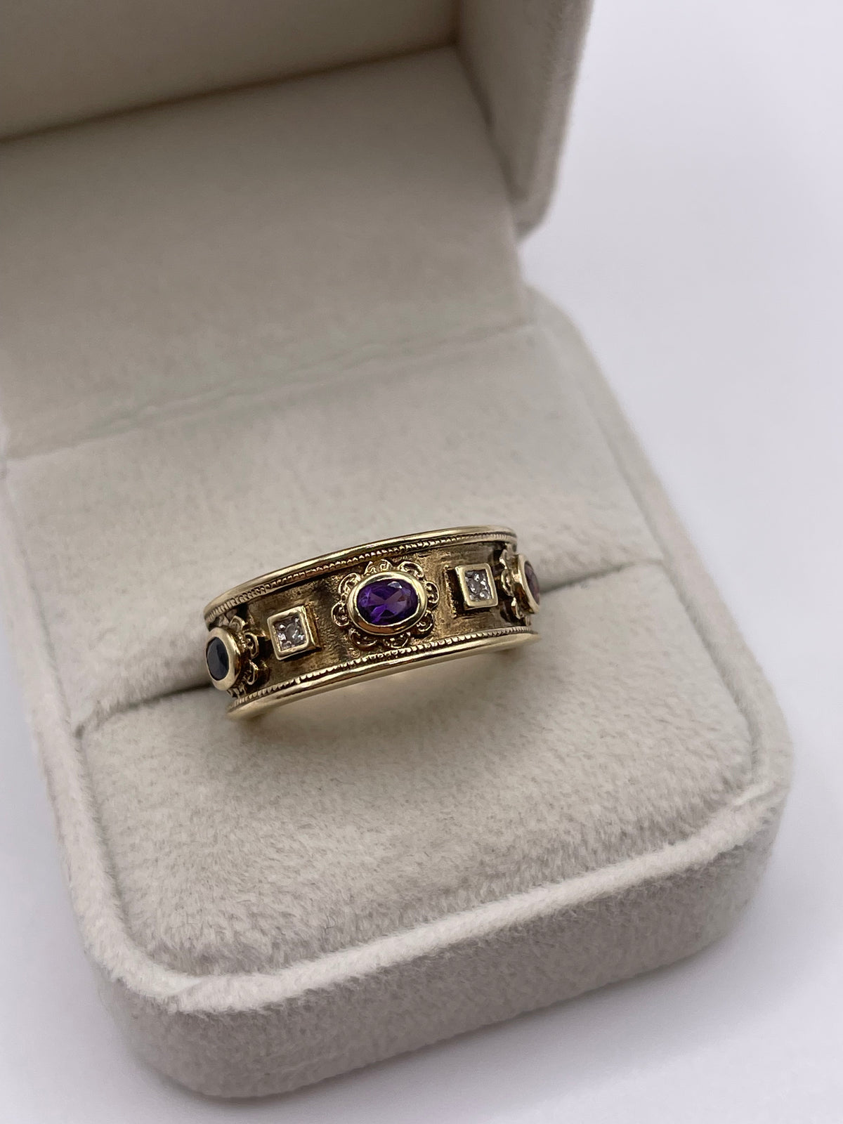 9ct gold garnet, amethyst, sapphire and diamond ring