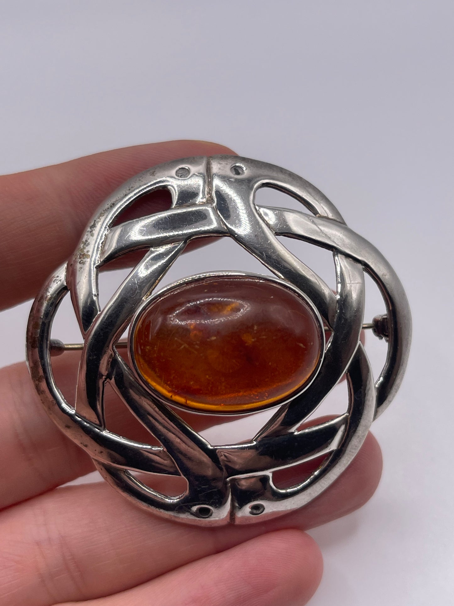 Silver amber brooch