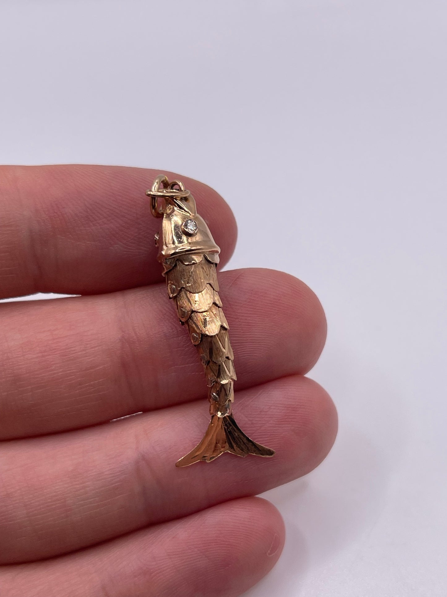 14ct rose gold diamond articulated fish pendant