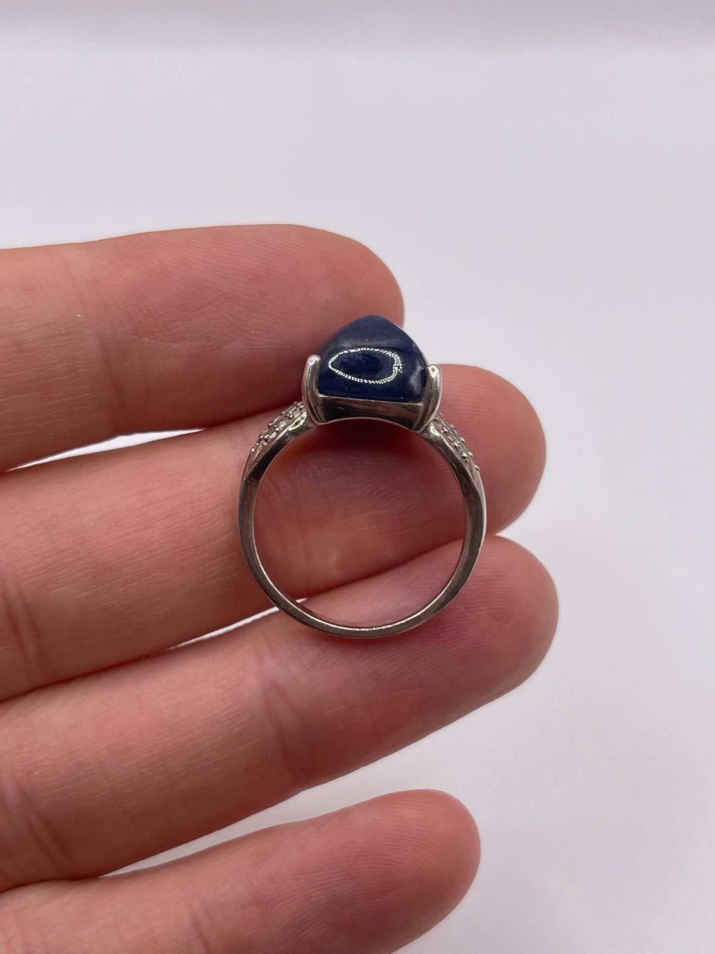 Silver cabochon sapphire and zircon ring