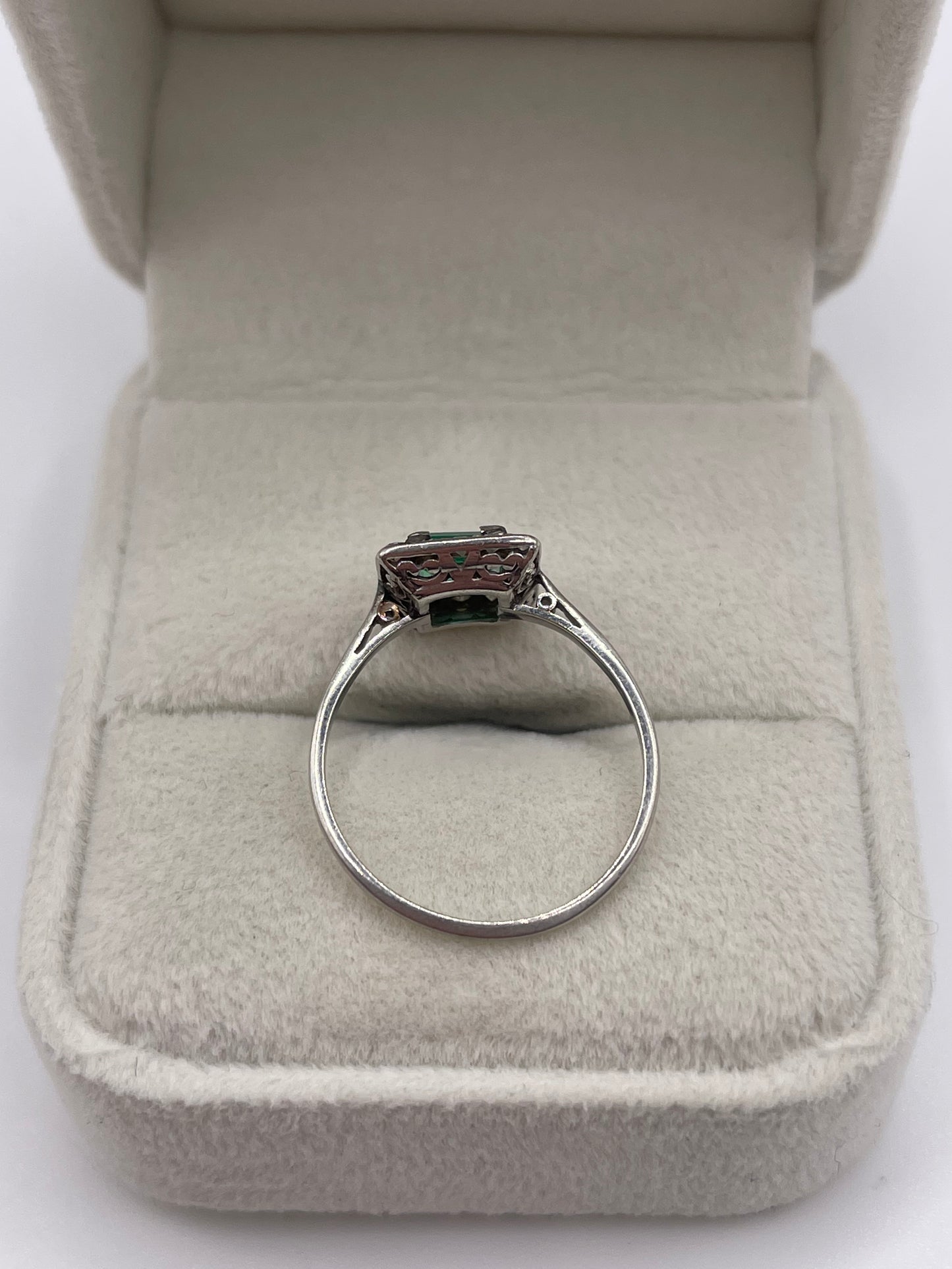 Platinum emerald and diamond ring