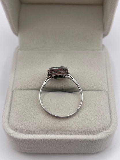 Platinum emerald and diamond ring
