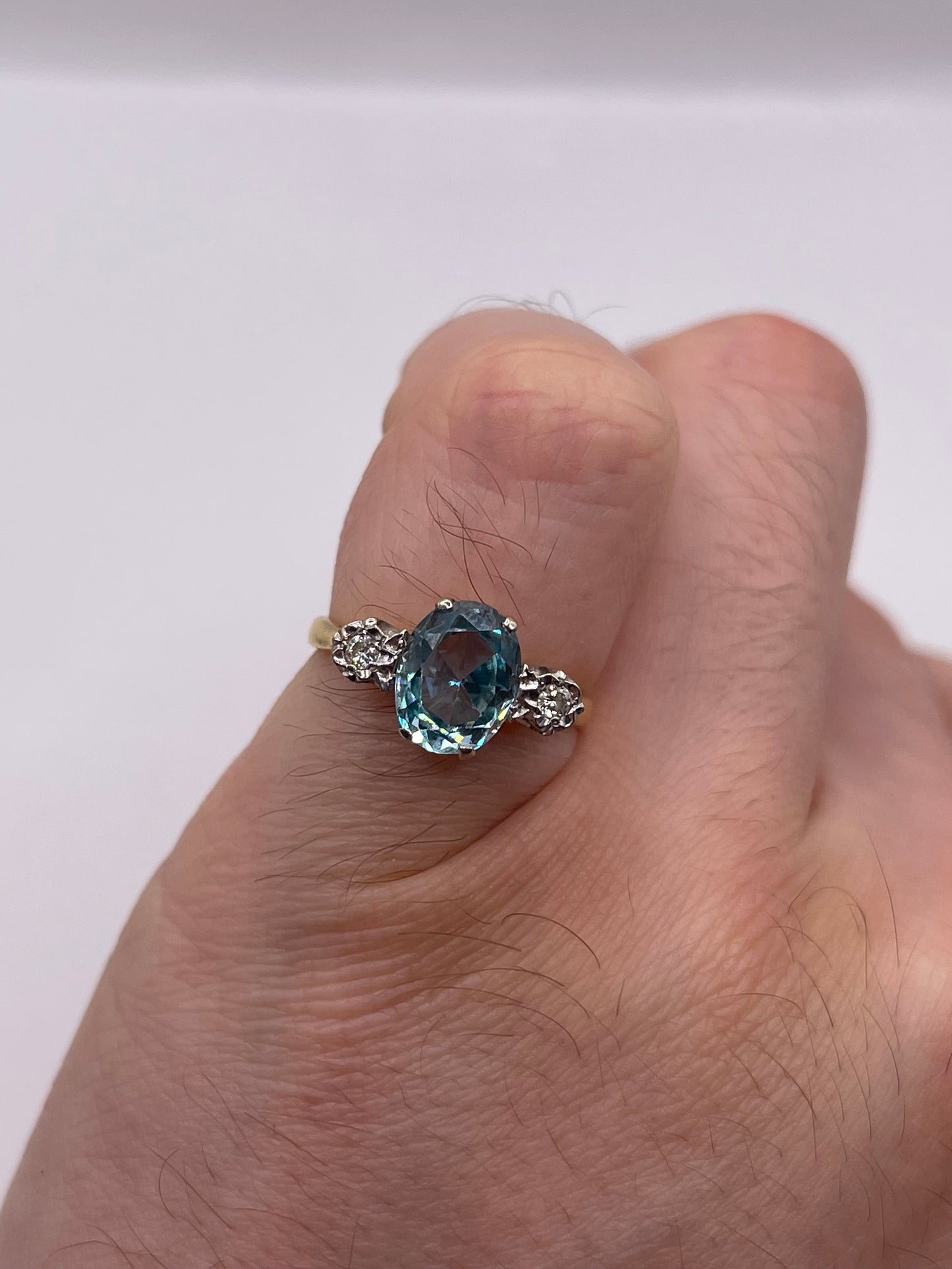 18ct gold blue zircon and diamond ring