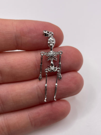 Silver articulated skeleton pendant