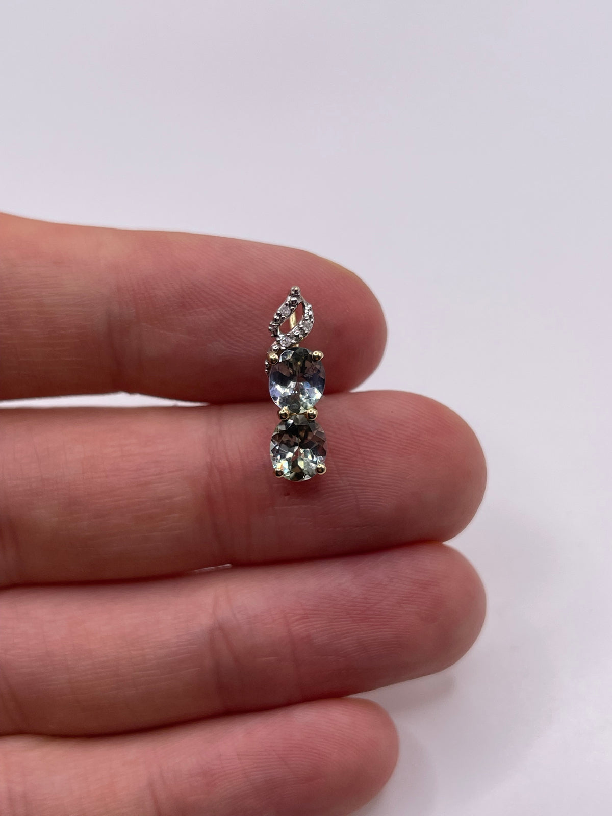 9ct gold tanzanite and diamond pendant