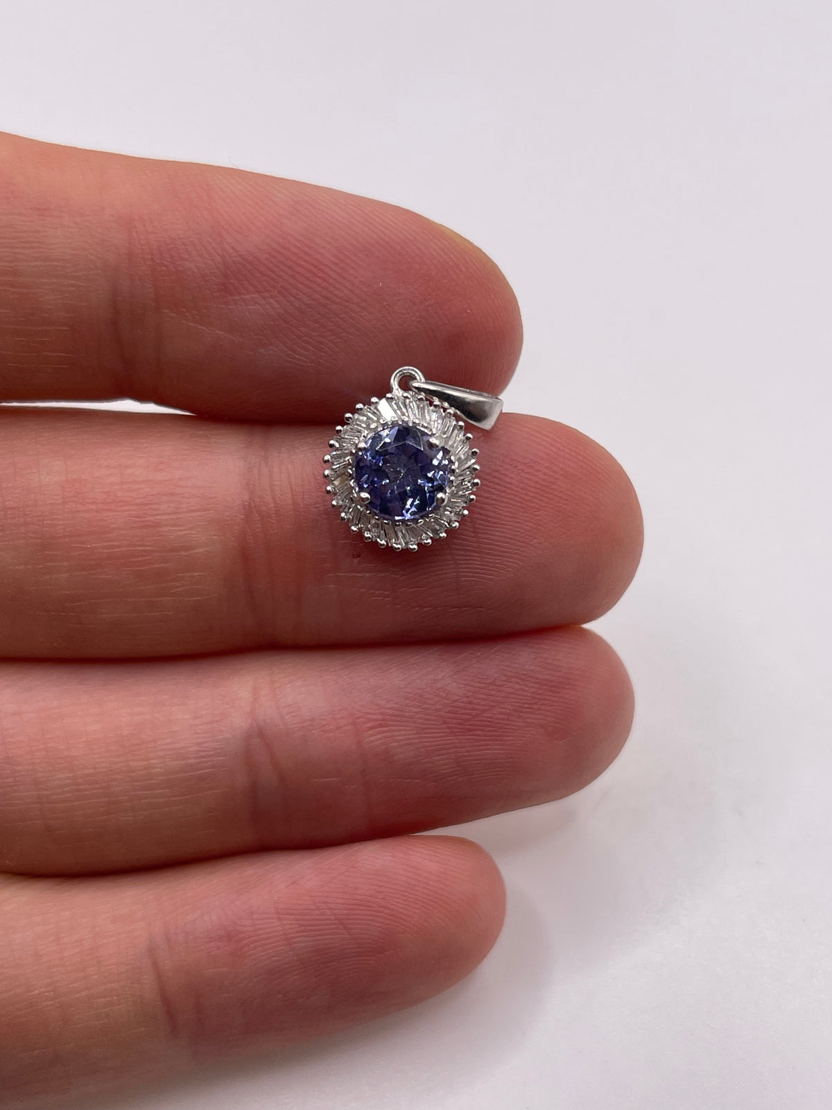 9ct white gold tanzanite and diamond pendant